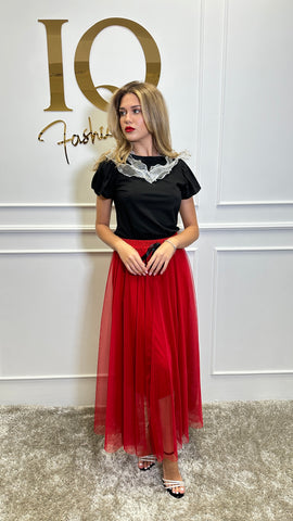 Red Valia skirt by ELVE STYLE SRL, showing a stylish, knee-length design with a fitted waist and elegant fabric.