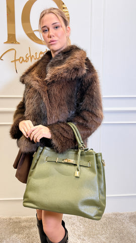 Natural leather handbag Hermina by ELVE STYLE SRL, showing a stylish, textured leather poseta with a shoulder strap.