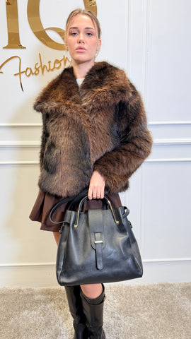 Natural leather Hermina handbag by ELVE STYLE SRL, featuring a stylish design with handles and textured leather surface.