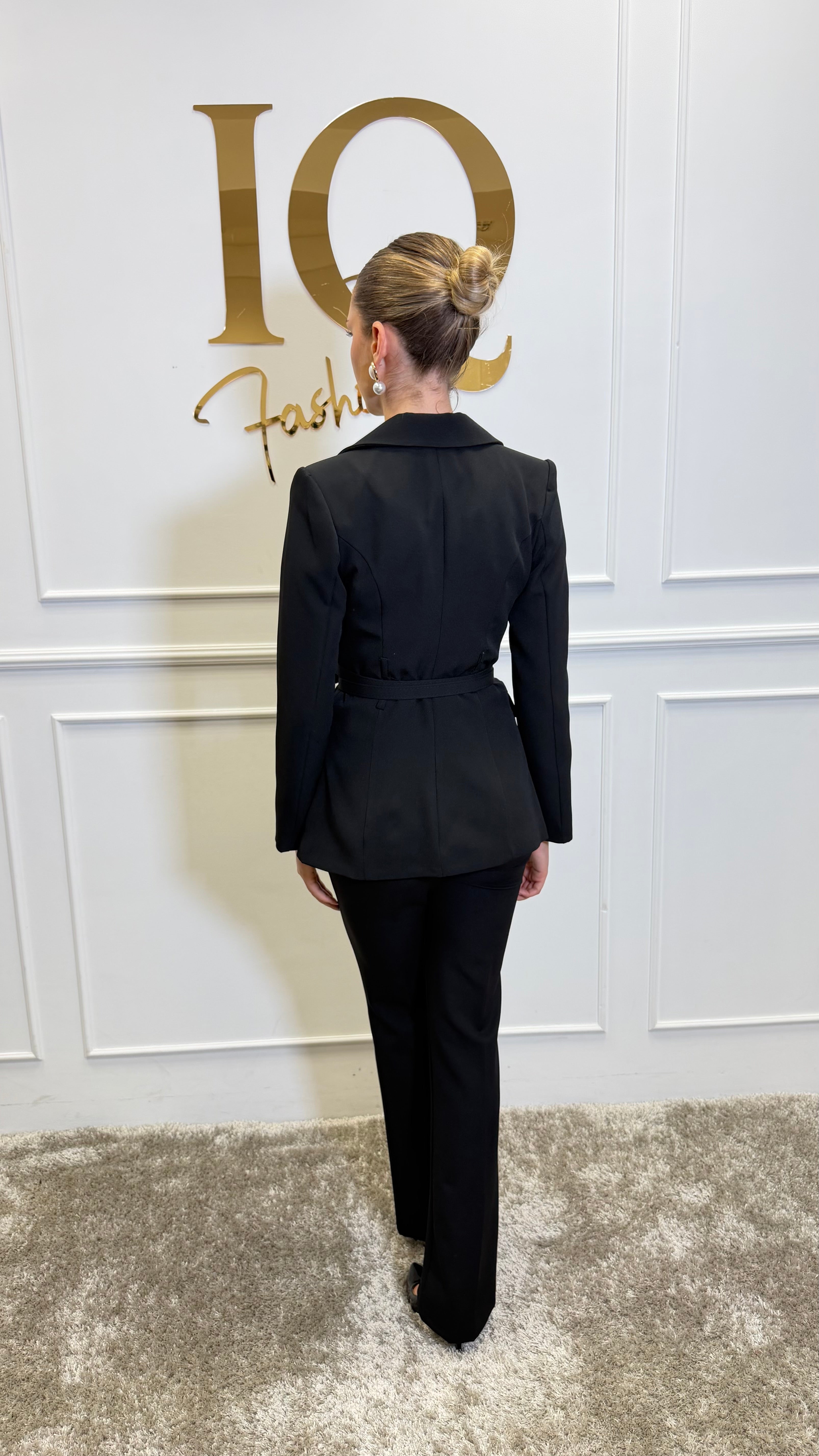 Black costume with double belt from ELVE STYLE SRL, featuring a stylish design and detailed fabric visible in the image.