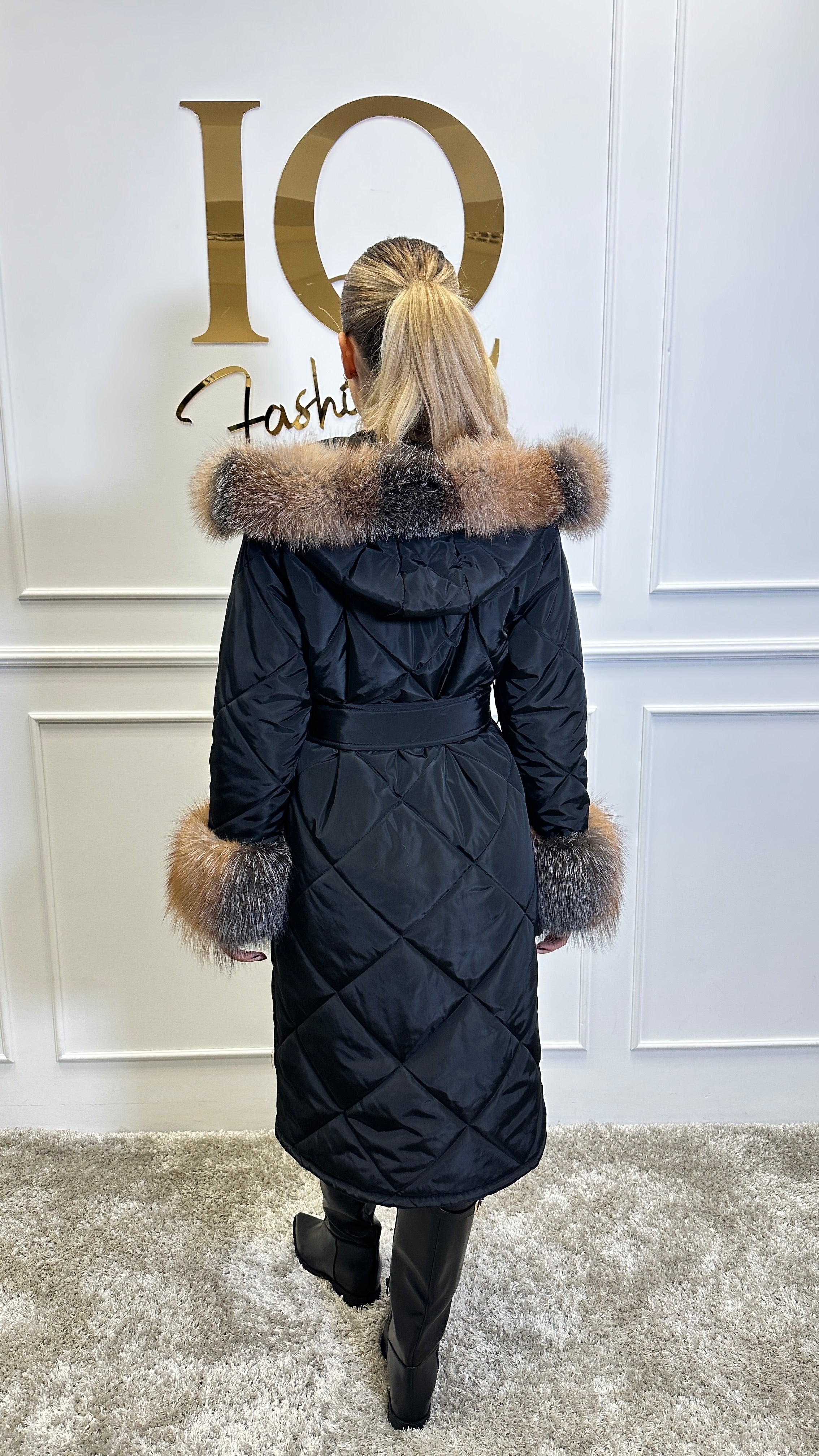 Black and gold faux fur coat by ELVE STYLE SRL with natural fur accents, stylish and luxurious outerwear for cold weather.
