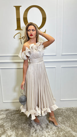 Nude Kassilia dress by iqfashioncluj displayed on a hanger, showcasing its elegant fabric and simple design.